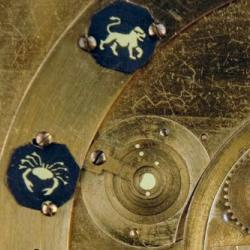 Detail from the face of the projecting planetarium showing part of the mechanism and some of the planets